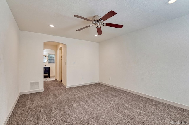 unfurnished room with carpet flooring and ceiling fan