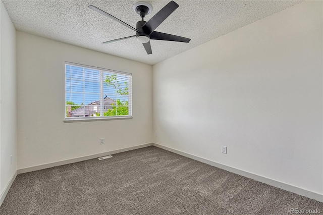 unfurnished room featuring a textured ceiling, carpet floors, and ceiling fan