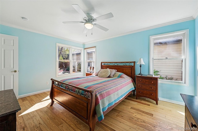2252 S Yosemite Cir, Denver, CO 80231 - bedroom with crown molding, a ceiling fan, baseboards, and light wood finished floors