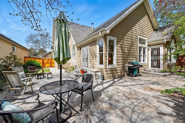 2252 S Yosemite Cir, Denver, CO 80231 - view of patio with a fenced backyard and area for grilling
