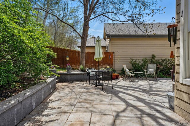 2252 S Yosemite Cir, Denver, CO 80231 - view of patio / terrace with fence and outdoor dining space