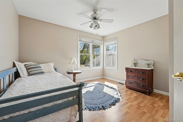 2252 S Yosemite Cir, Denver, CO 80231 - bedroom with baseboards, ceiling fan, light wood-style flooring, and visible vents