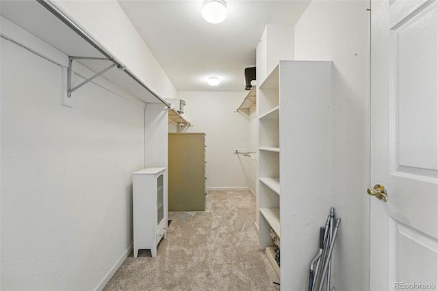 2252 S Yosemite Cir, Denver, CO 80231 - walk in closet featuring light colored carpet