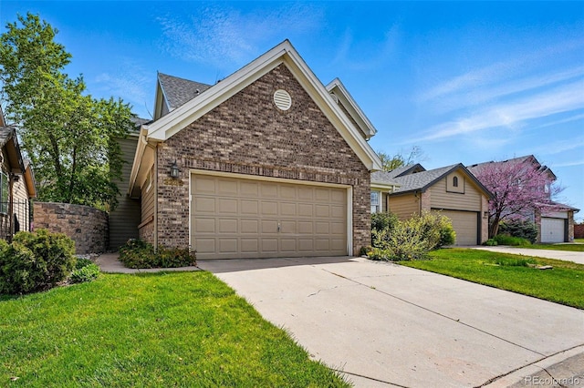 2252 S Yosemite Cir, Denver, CO 80231 - ranch-style house featuring brick siding, driveway, a front lawn, and a garage