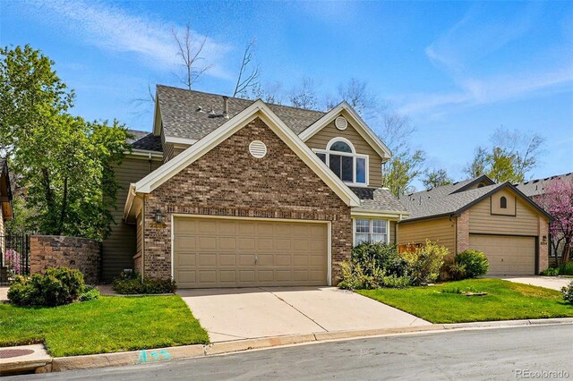 2252 S Yosemite Cir, Denver, CO 80231 - traditional-style house featuring concrete driveway, brick siding, a shingled roof, and a front lawn