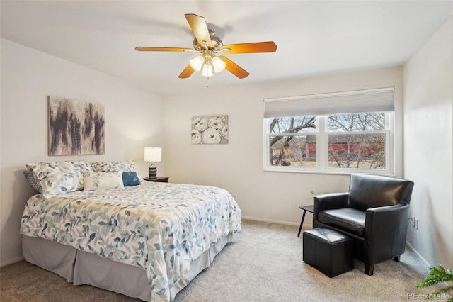 bedroom featuring baseboards, a ceiling fan, and light colored carpet