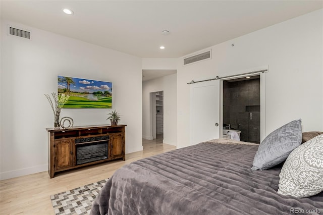 bedroom featuring visible vents, recessed lighting, and wood finished floors