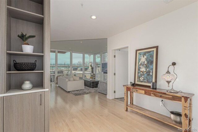 hallway featuring recessed lighting and light wood-style floors