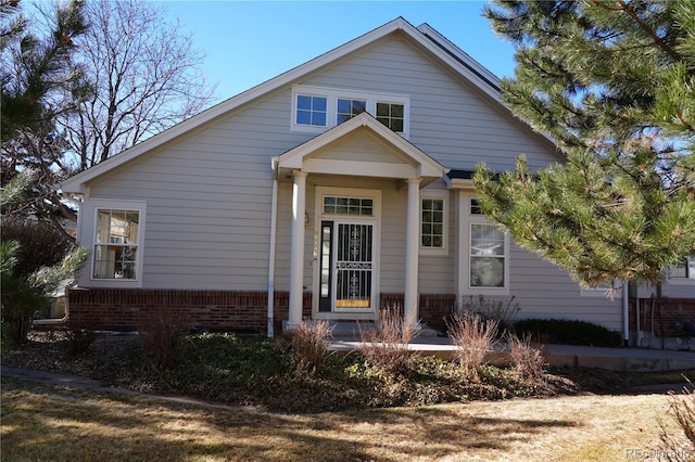 bungalow-style house featuring brick siding