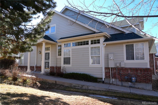 bungalow-style house with roof with shingles