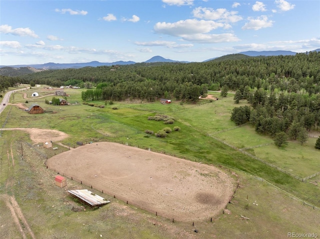 birds eye view of property featuring a mountain view and a rural view