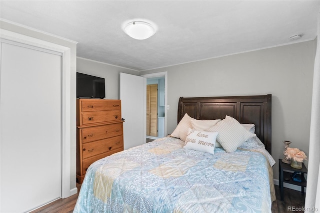 bedroom featuring hardwood / wood-style floors and ornamental molding