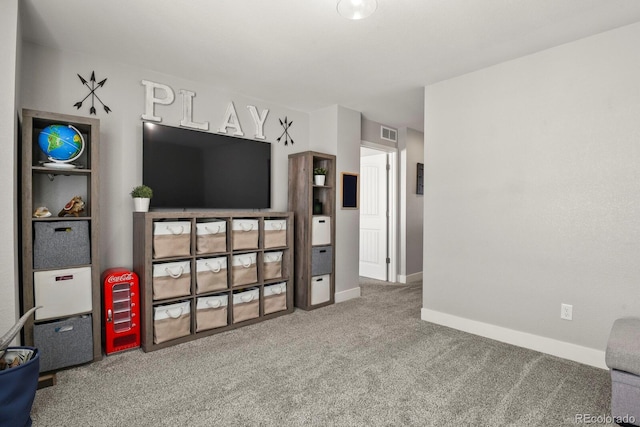 carpeted living room with visible vents and baseboards