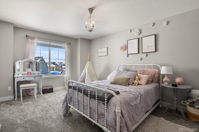 bedroom with carpet, an inviting chandelier, and baseboards