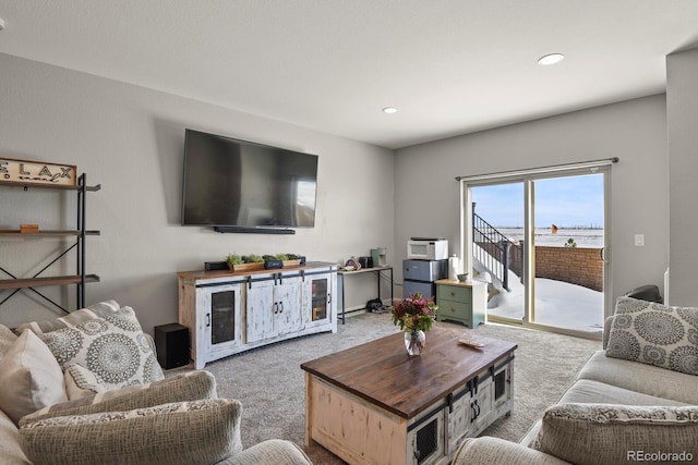 living room featuring recessed lighting and light colored carpet