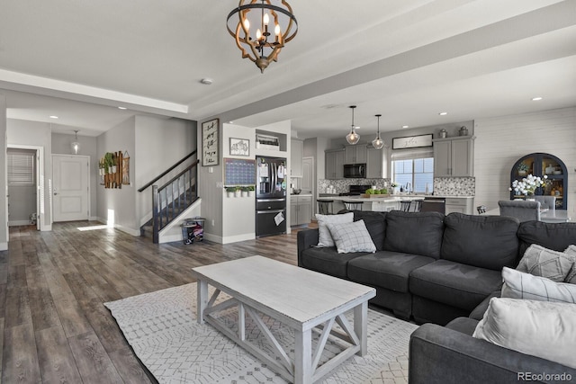 6654 Backcountry Loop, Colorado Springs, CO 80927 - living area with baseboards, a chandelier, stairway, dark wood finished floors, and recessed lighting