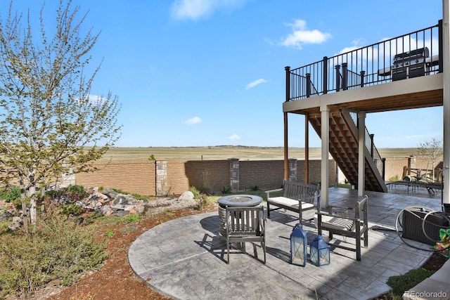 6654 Backcountry Loop, Colorado Springs, CO 80927 - view of patio / terrace with a fire pit, stairway, fence, and a wooden deck