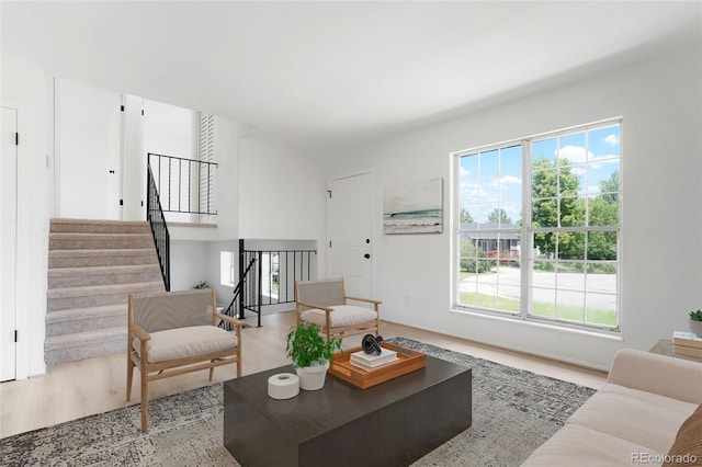 16322 E Idaho Pl, Aurora, CO 80017 - living area featuring wood finished floors and stairway