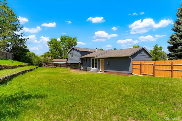 16322 E Idaho Pl, Aurora, CO 80017 - rear view of property with a fenced backyard and a shingled roof