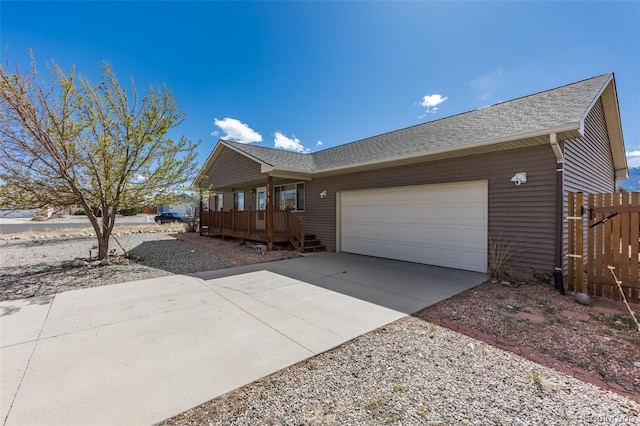 132 Windwalker Rd, Buena Vista, CO 81211 - exterior space with fence, an attached garage, driveway, and roof with shingles