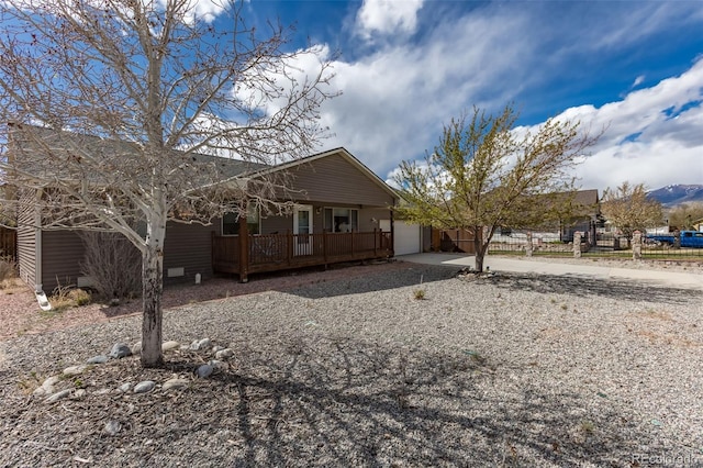 132 Windwalker Rd, Buena Vista, CO 81211 - view of front of home featuring a garage, fence, concrete driveway, and a porch