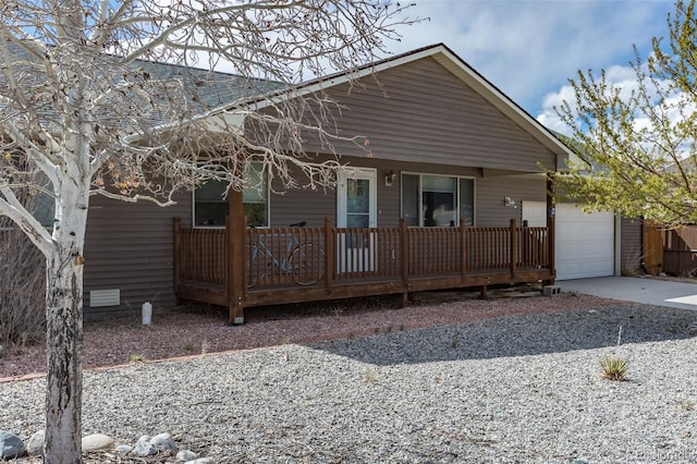 132 Windwalker Rd, Buena Vista, CO 81211 - view of front of home with an attached garage, concrete driveway, and a porch