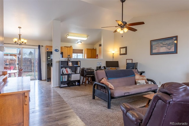 132 Windwalker Rd, Buena Vista, CO 81211 - living room featuring plenty of natural light, light wood-style flooring, ceiling fan with notable chandelier, and lofted ceiling