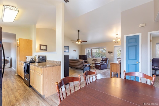 132 Windwalker Rd, Buena Vista, CO 81211 - dining area with high vaulted ceiling, washer / dryer, ceiling fan with notable chandelier, and light wood-style floors