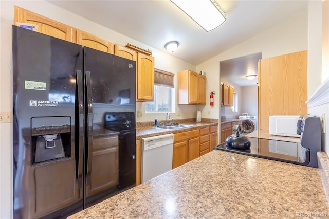 132 Windwalker Rd, Buena Vista, CO 81211 - kitchen featuring black fridge with ice dispenser, dishwasher, a sink, lofted ceiling, and washer / dryer
