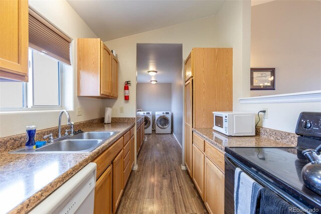 132 Windwalker Rd, Buena Vista, CO 81211 - kitchen featuring dark wood-style flooring, lofted ceiling, white appliances, separate washer and dryer, and a sink