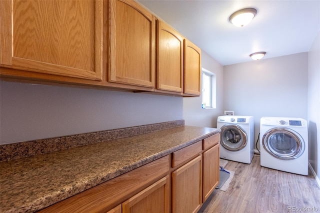 132 Windwalker Rd, Buena Vista, CO 81211 - laundry room with separate washer and dryer, light wood finished floors, and cabinet space