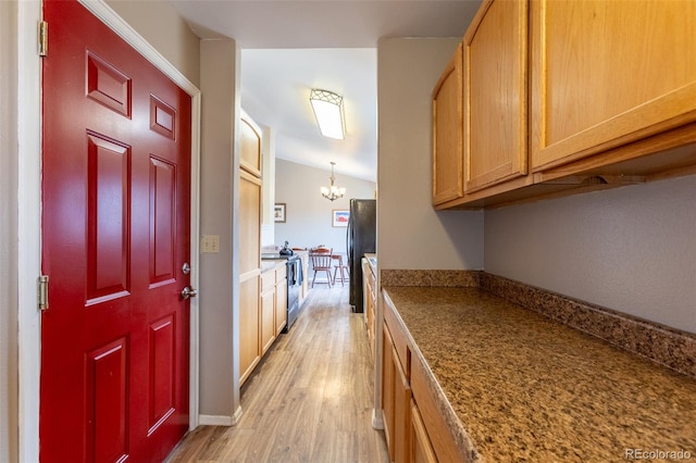 132 Windwalker Rd, Buena Vista, CO 81211 - hallway with light wood-type flooring, a chandelier, and vaulted ceiling