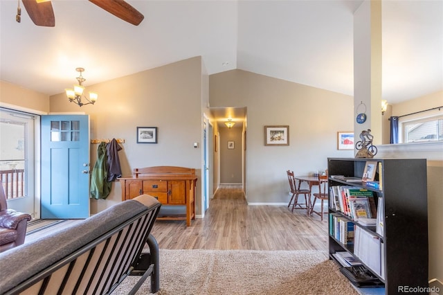 132 Windwalker Rd, Buena Vista, CO 81211 - entrance foyer featuring baseboards, wood finished floors, lofted ceiling, and ceiling fan with notable chandelier