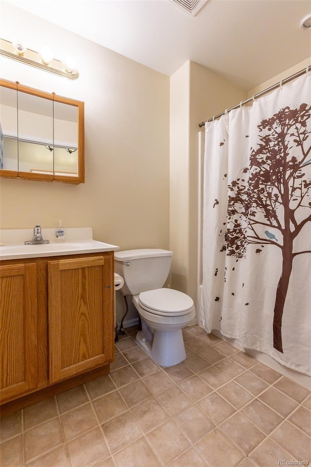 132 Windwalker Rd, Buena Vista, CO 81211 - bathroom with toilet, tile patterned flooring, and vanity