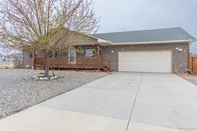132 Windwalker Rd, Buena Vista, CO 81211 - single story home featuring an attached garage, roof with shingles, fence, and concrete driveway