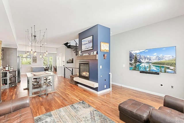 2335 Walnut St Unit 10, Denver, CO 80205 - living area with wood finished floors and a glass covered fireplace