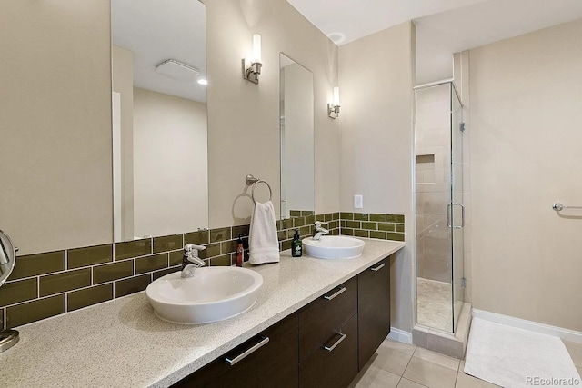 2335 Walnut St Unit 10, Denver, CO 80205 - full bathroom featuring a stall shower, double vanity, backsplash, and tile patterned flooring