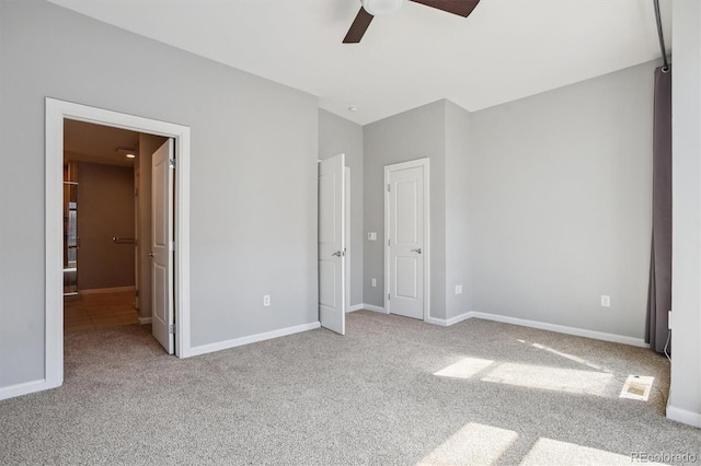 2335 Walnut St Unit 10, Denver, CO 80205 - unfurnished bedroom with carpet, connected bathroom, and a ceiling fan