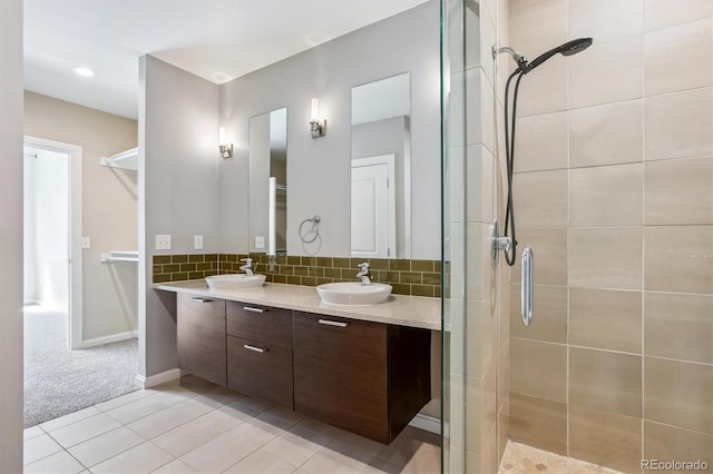 2335 Walnut St Unit 10, Denver, CO 80205 - full bathroom featuring double vanity, a shower stall, tasteful backsplash, and tile patterned floors