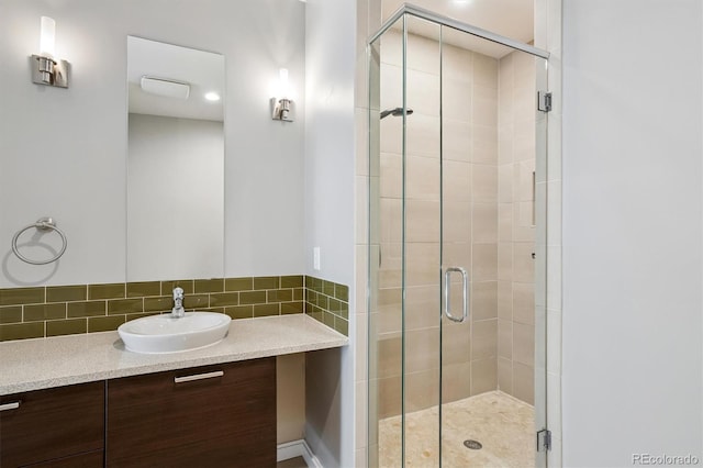 2335 Walnut St Unit 10, Denver, CO 80205 - full bathroom featuring a shower stall, vanity, and decorative backsplash