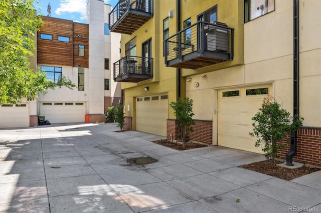 2335 Walnut St Unit 10, Denver, CO 80205 - exterior space featuring an attached garage and concrete driveway