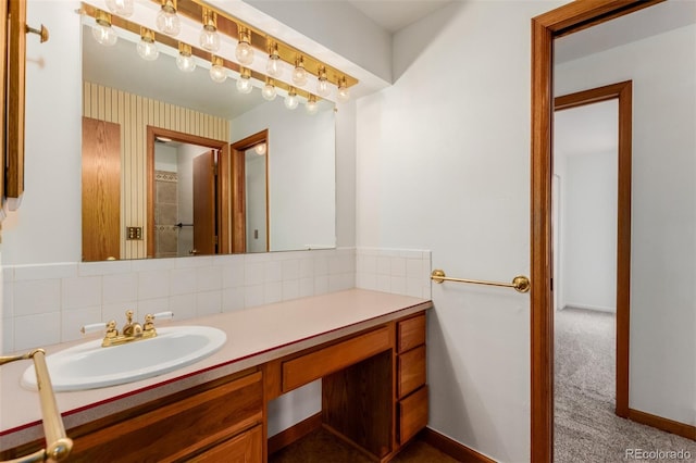 bathroom featuring decorative backsplash and vanity