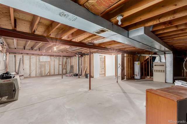 basement featuring gas water heater and heating unit