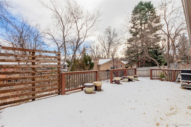 view of snow covered deck