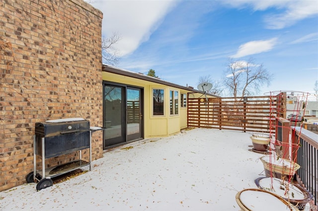 view of snow covered patio