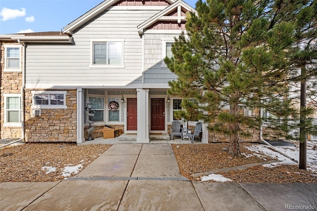 view of property with stone siding and board and batten siding