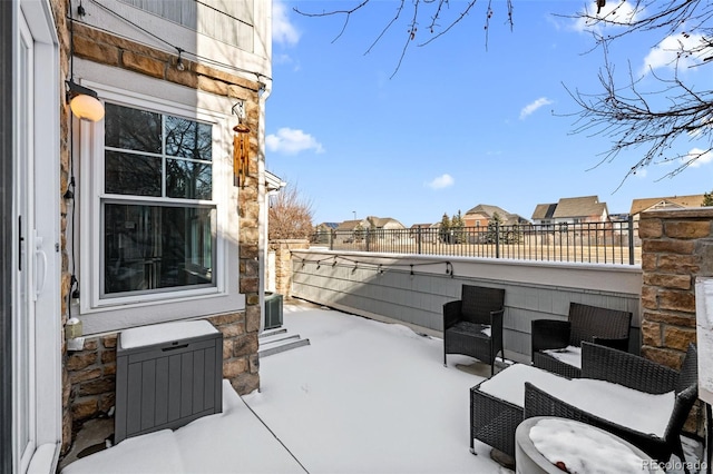 view of patio featuring fence