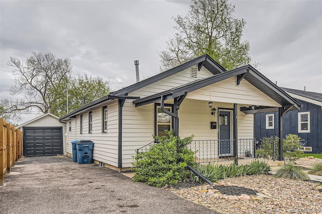 3930 S Sherman St, Englewood, CO 80113 - bungalow-style house featuring covered porch, driveway, an outdoor structure, and a detached garage