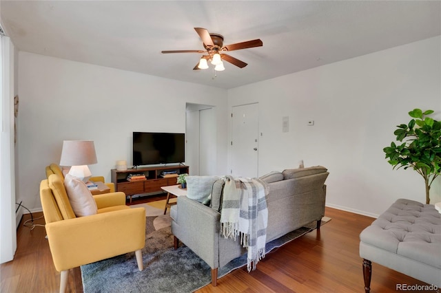 1201 Race St Unit 10, Denver, CO 80206 - living area with ceiling fan, wood finished floors, and baseboards