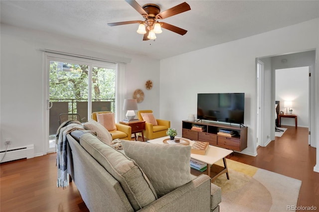 1201 Race St Unit 10, Denver, CO 80206 - living area featuring wood finished floors, a ceiling fan, and a baseboard radiator